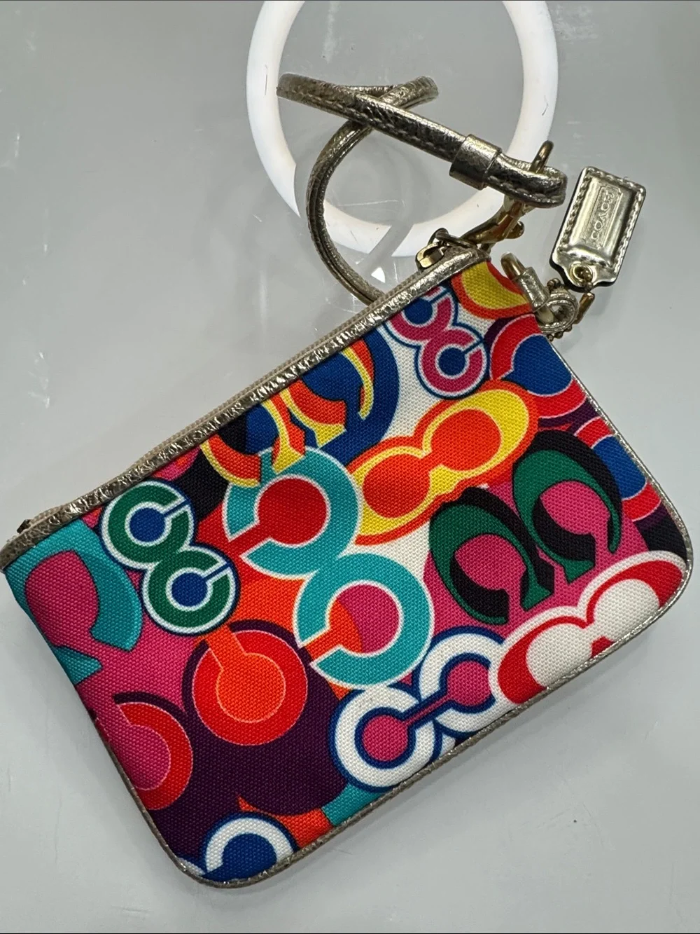 Coach Poppy Multicolor signature wristlet with gold accents and hangtag